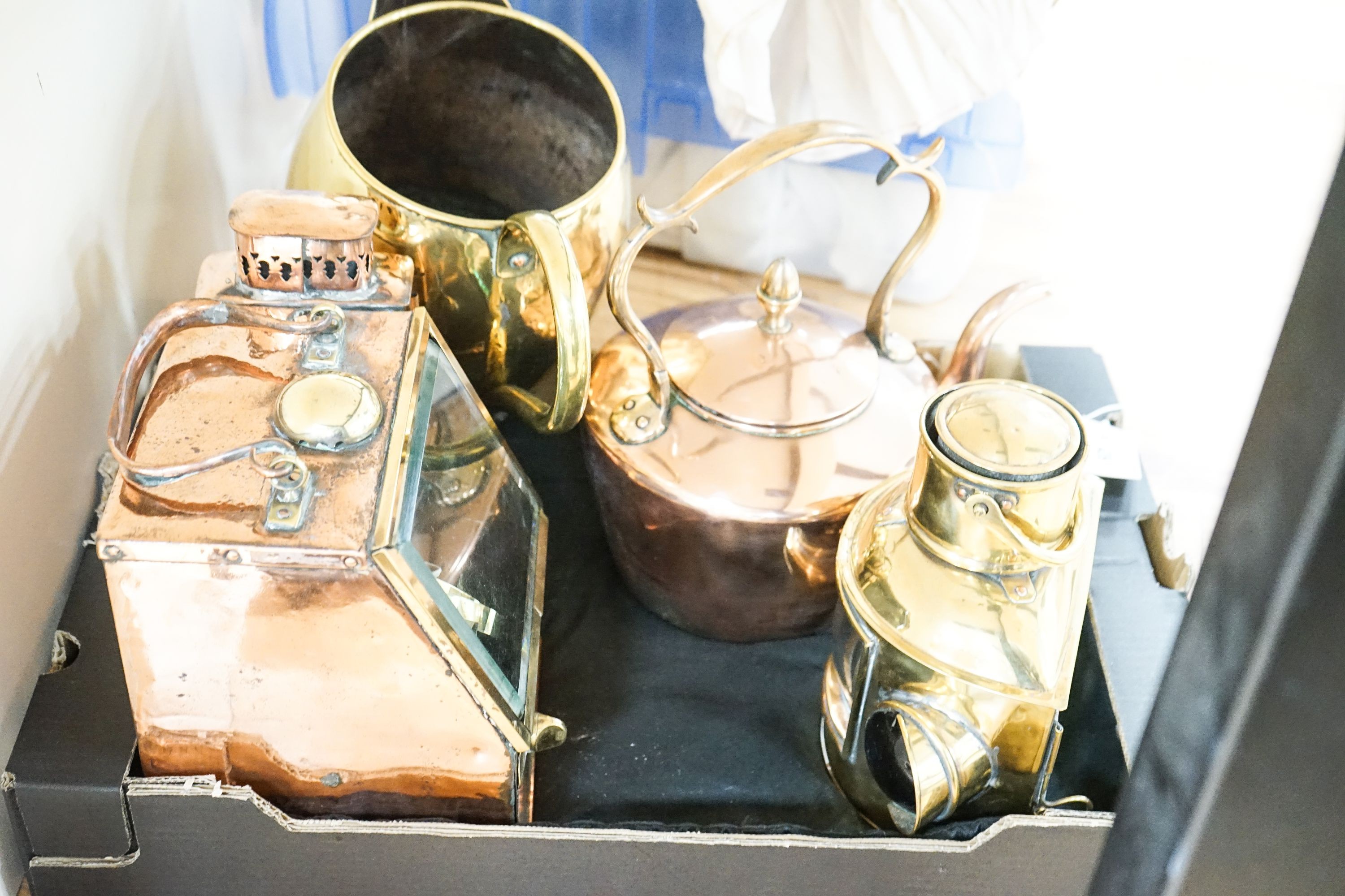 A copper ship's binnacle compass, a brass oil lamp, a brass jug and a copper kettle